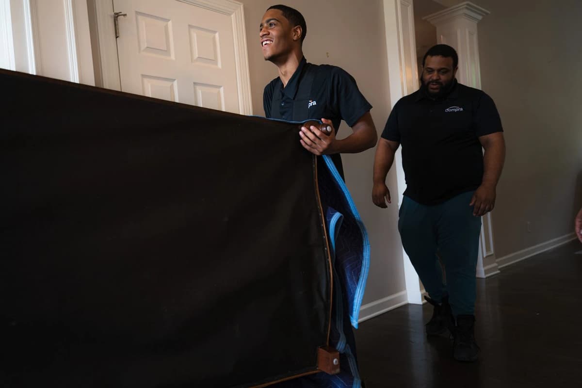 Professional movers loading truck